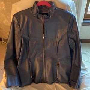 Terry Lewis womens grey leather jacket with gold hardware. Size medium.